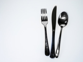 fork spoon and knife on white