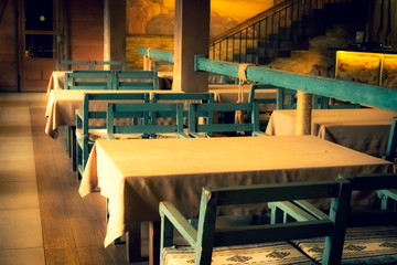 Restaurant interior in the morning. Table and chairs in a cafe.
