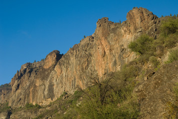 Fototapeta na wymiar Cliff in the Roque Nublo Natural Monument. The Nublo Rural Park. Tejeda. Gran Canaria. Canary Islands. Spain.