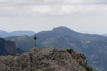 mountain top view with a cross