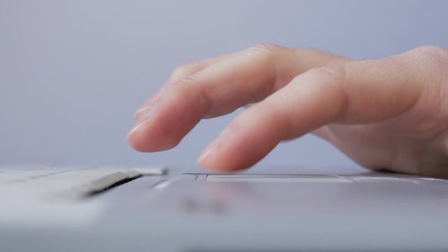 Using computer touchpad close-up