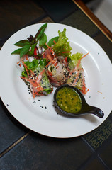 Fresh shrimp vegetable healthy roll with curry sauce. Thai appetizer.