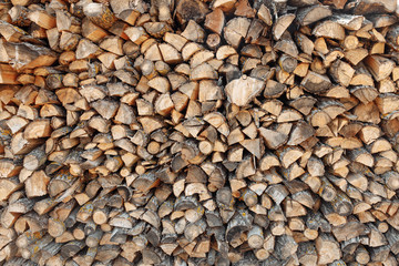 wall firewood , Background of dry chopped firewood logs in a pile