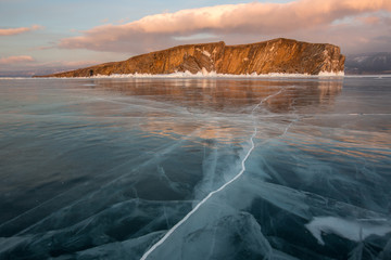 Lake Baikal. Rocky island in the ice on a sunny day