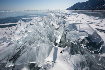 Fototapeta na wymiar Beautiful clear ice of Lake Baikal on a sunny day