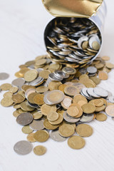 Pour out coins savings on white table