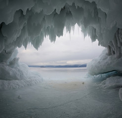 ice grotto on lake baikal at sunrise