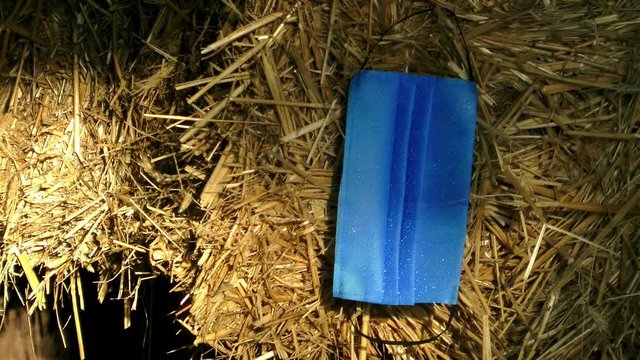 Mask from coronavirus on a haystack