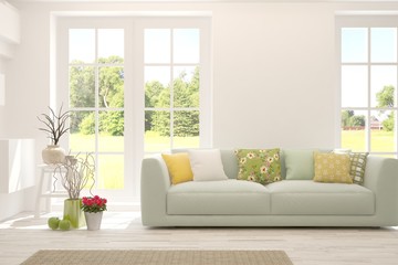 White living room with sofa and summer landscape in window. Scandinavian interior design. 3D illustration