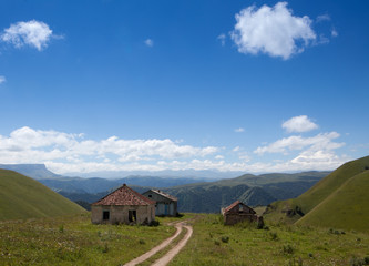 Abandoned village overlooking Mount Elbrus. Old house and amazing nature