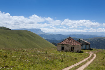 Abandoned village overlooking Mount Elbrus. Old house and amazing nature