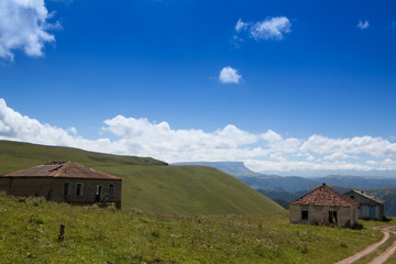 Abandoned village overlooking Mount Elbrus. Old house and amazing nature