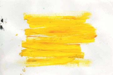Abstract acrylic yellow brush stroke on white background.The color splashing on the paper.It is a hand drawn illustration.