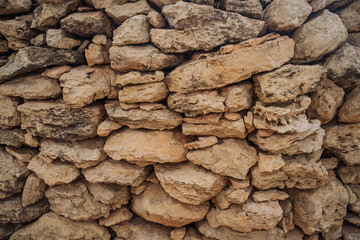 stone fence, the texture of the stone, the element of the fence
