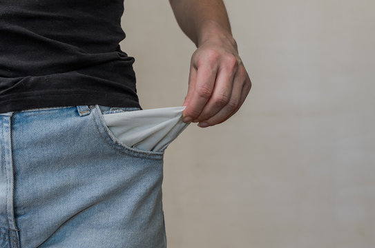 Woman in jeans twists empty pockets	