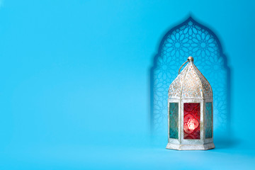 Ramadan Lantern in front of arabesque gate, us it for greeting cards.