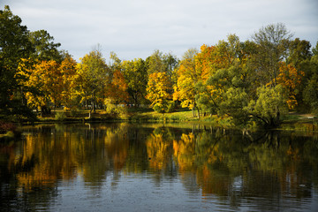 Fototapeta na wymiar colorful autumn landscape, lake with reflection of trees