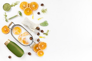 self-care kit for body and face. soap nuts, coconut oil, spirulina powder, jade roller for massage guasha, towel. DIY eco cosmetics. concept zero waste, no plastic, sustainable. mock up. flat lay