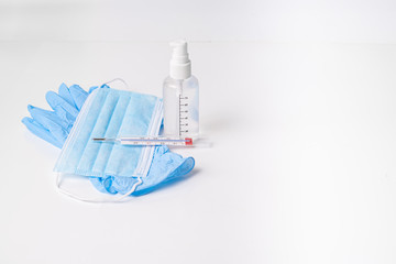 nitrile gloves with hydroalcoholic gel surgical mask and thermometer