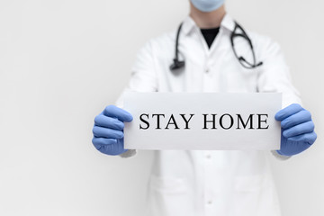 Doctor with the words stay home. Coronavirus, covid-19, healthcare concept. Self isolation. Quarantine.