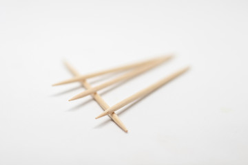 Wooden toothpicks on a white background