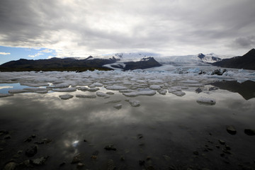 Fjallsarlon / Iceland - August 18, 2017: Fjallsarlon Glacier Lagoon view with ice formations, Iceland, Europe