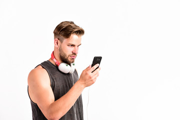 using technology for leisure or education. ebook and online education. music education. sexy muscular man listen ebook. man in earphones isolated on white. e book. unshaven man study inline