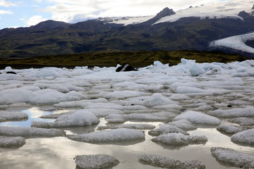 Fjallsarlon / Iceland - August 18, 2017: Fjallsarlon Glacier Lagoon view with ice formations, Iceland, Europe