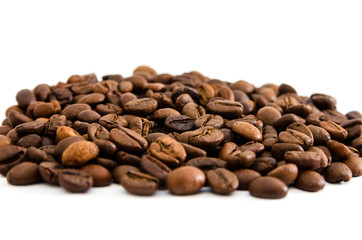 Pile of roasted coffee beans isolated on white background.