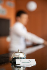 Modern luxury hotel reception counter desk with bell
