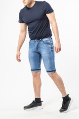 Obraz premium a man in denim shorts on a white background