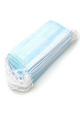 a stack of medical coronavirus face masks on a white background