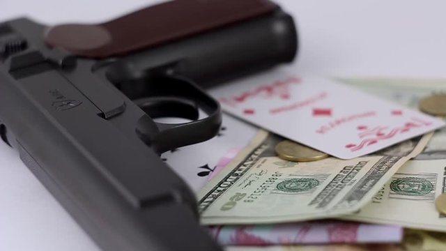 Black gun, money and cards.