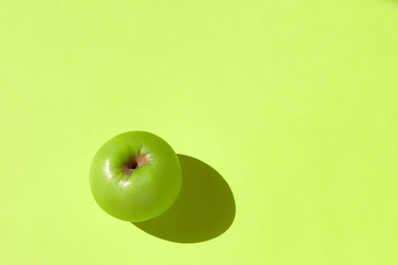 Fresh apple on a green background.
