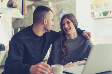 Young couple have fun and enjoying in cafe