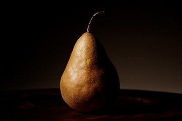 Fresh pear on brown background