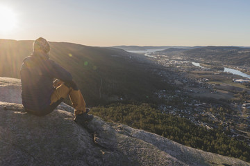 A man looking at Drammen city.