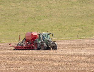 Obraz premium Tractor pulling a seed drill