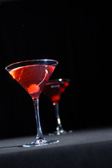Red cocktail in martini glass
