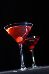 Red cocktail in martini glass
