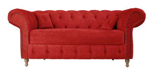 Red sofa with pillows on wooden legs isolated on white. Red suede couch isolated