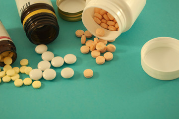 jars with pills on blue background