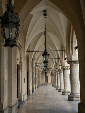 Empty arcades of Sukiennice on empty Krakow's Main Market Square during covid-19 coronavirus pandemic.