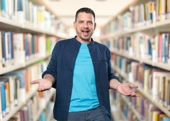 Young man wearing a blue outfit. Looking confused.