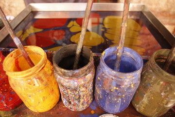 Fototapeta na wymiar Colorful painted jars in marbling art