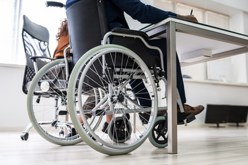 Fototapeta na wymiar Disabled Businessman Sitting On Wheelchair