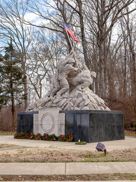 Washington D.C., USA - February 29,  2020: Raising The Flag On Iwo Jima Statue In A Park Adjacent To Arlington National Cemetery In Washington DC. The Statue Is A Photo Cast In Bronze. 