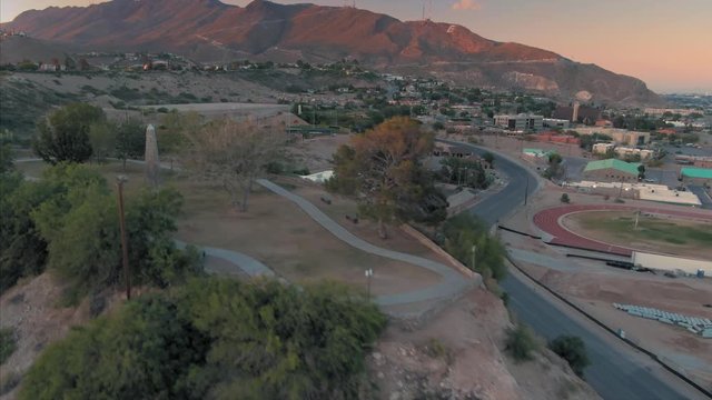 Aerial: El Paso suburbs & Tom Lea Upper Park at sunset. Texas, USA