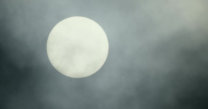 Sun covered with dark clouds, Compton Abbas, Dorset, UK