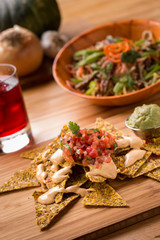 Raw Nachos with pico de gallo vegan cheese and guacamole